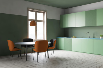 Green kitchen corner, green counters and table