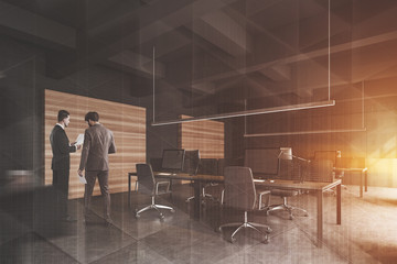 People in gray open space office corner