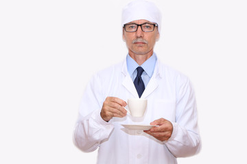Healthy Eating - the doctor holds in his hand a cup of coffee