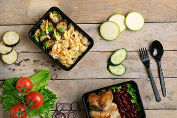 plastic spoon and fork to eat lunch in box, food containers