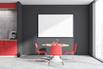 Red and gray kitchen with table and poster