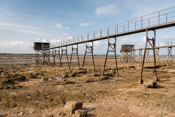 boardwalk made of wood on a beach near La Rochelle