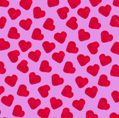 Hearts knitted red texture background