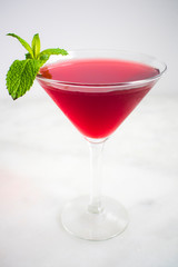 Red Cocktail with Mint Garnish
