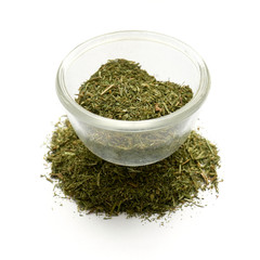 ground dill dried isolated  in a glass plate