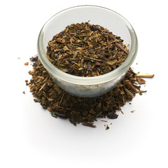 dried basil isolated  in a glass plate