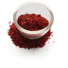 minced paprika isolated in  a glass plate