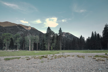 Surrounded by mountains as we walk along the lake