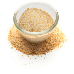 crushed dried garlic isolated in  a glass plate