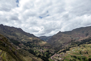 View of Pisac Archaeological Park and green mountains of the Sacred Valley of the Incas, Peru