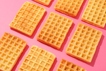 Flat lay composition with belgian waffles on color background