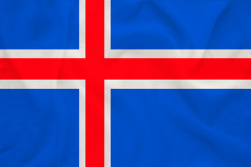 national flag of the country iceland on delicate silk with creases from the wind, concept of...