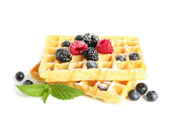 Belgian waffles with berries and mint isolated on white background