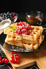 Beautiful composition with sweet belgian waffles, space for text