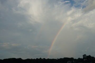Rainbow and Clouds with Blue Sky