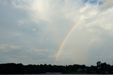 Rainbow and Clouds with Blue Sky