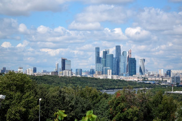 Fototapeta premium Moscow, Russia - July 8, 2019: The view of Moscow and cloudy blue sky from the Sparrow Hills observation deck on a sunny day
