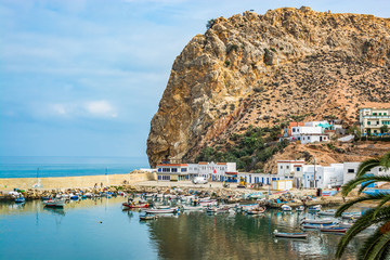 El Jebha, Morocco - October 19, 2013. Marina with colored boats by Mediterranean Sea