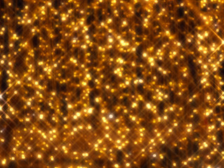 Blurred background of festive yellow lights on a dark background.