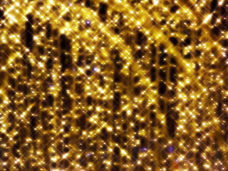 Blurred background of festive yellow lights on a dark background.