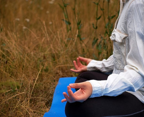 Young girl do yoga outdoor.