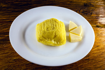 Pamonha, Brazilian sweet corn with cheese filling. Pamonha typical of Brazil, food of the state of minas gerais and goiais. Concept of traditional food. Brazilian food at rural parties
