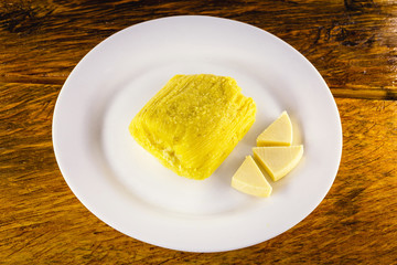 Pamonha, Brazilian sweet corn with cheese filling. Pamonha typical of Brazil, food of the state of minas gerais and goiais. Concept of traditional food. Brazilian food at rural parties