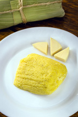 pamonha, Brazilian sweet made from homemade cheese with corn. Open pissing ready for consumption. Concept of traditional Brazilian sweet, typical food of the months of June and July.