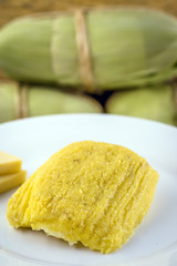 pamonha, Brazilian sweet made from homemade cheese with corn. Open pissing ready for consumption. Concept of traditional Brazilian sweet, typical food of the months of June and July.