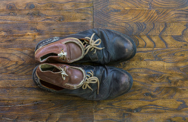 Father and son brown shoes on wooden background, fathers day