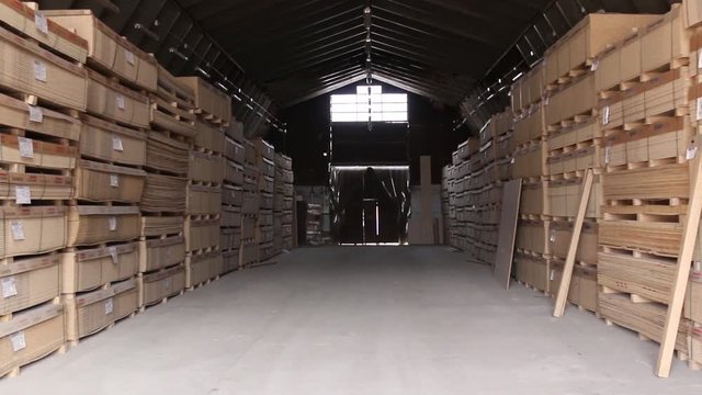 Sawn timber. Drywall, dvp, chipboard, Shelf with structural materials on the shelves in the construction warehouse.