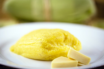 pamonha, Brazilian sweet made from homemade cheese with corn. Open pissing ready for consumption. Concept of traditional Brazilian sweet, typical food of the months of June and July.