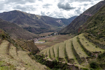 View of Pisac Archaeological Park and green mountains of the Sacred Valley of the Incas, Peru