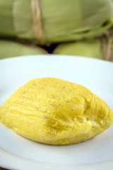 pamonha, Brazilian sweet made from homemade cheese with corn. Open pissing ready for consumption. Concept of traditional Brazilian sweet, typical food of the months of June and July.