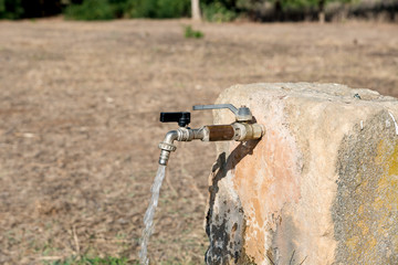 Fountain with tap and running water
