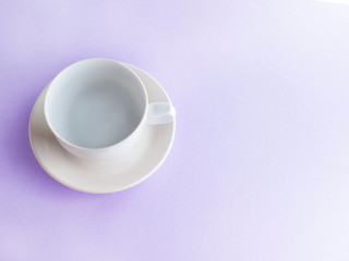Obraz na płótnie Canvas empty coffee cup on pink background top view
