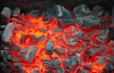 Red hot coals in the grill close up