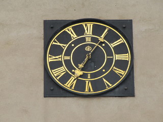 Clock on a Wall of Hrad Karlstejn in Karlstejn, the Czech Republic