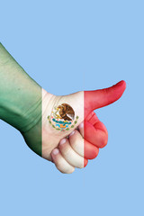 Mexico - Hitchhiking arround the country.  My Hand is painted in flag colors. Isolated