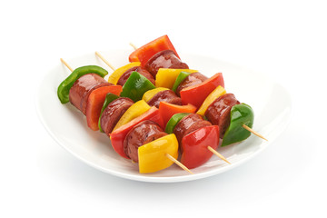 Pork sausage kebab and vegetables BBQ, close-up, isolated on white background