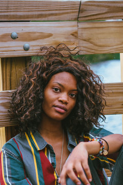 Lady in front of fence