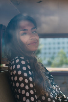 looks out with tight lips