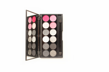 Palette of multicolor cosmetic make up with a mirror, pink and grey eye shadow palette space for text