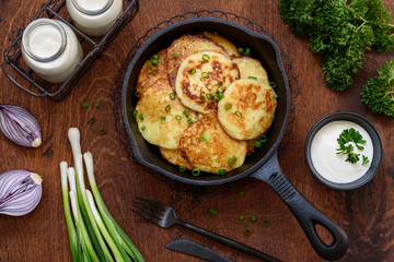 Fried potato fritters in a pan. Draniki - the national dish of Belarus, Ukraine and Russia.