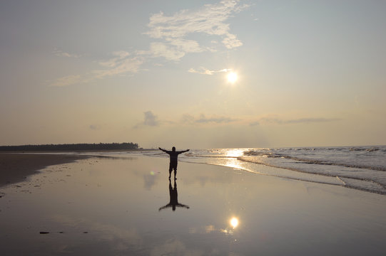 A Man Enjoying Sunrise On Sagar Island Sea Beach,India