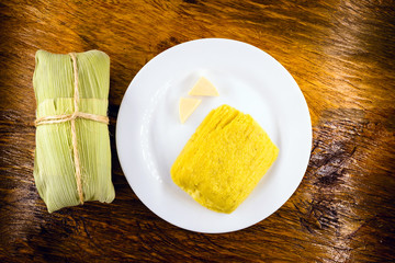 pamonha, Brazilian sweet made from homemade cheese with corn. Open pissing ready for consumption....