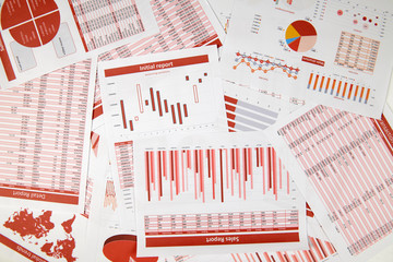 Flat top view of business workspace - reports with data, tables and analytic chart. Business...
