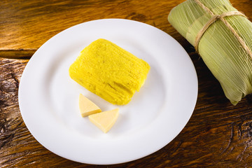 pamonha, Brazilian sweet made from homemade cheese with corn. Open pissing ready for consumption. Concept of traditional Brazilian sweet, typical food of the months of June and July.