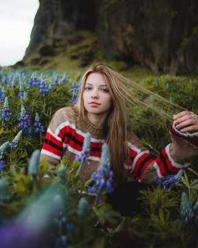 woman surrounded by flowers