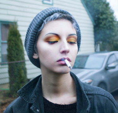 woman taking cigarette